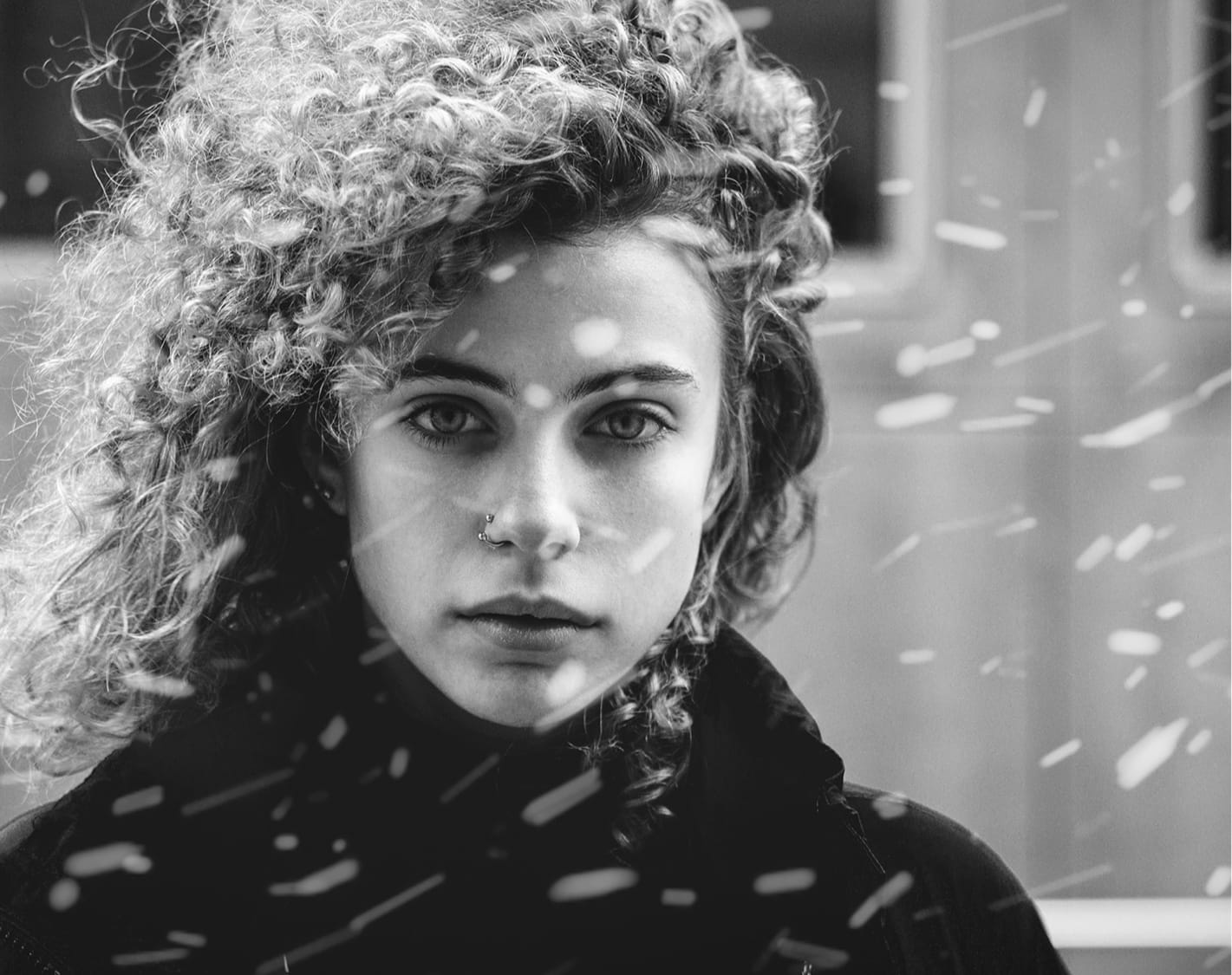 Woman with curly hair outside