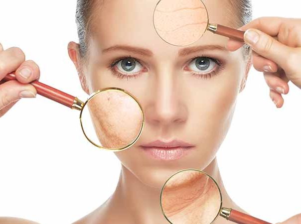 woman with magnifying glasses over her face