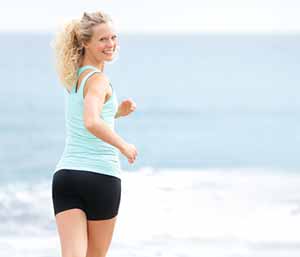 woman jogging on the beach